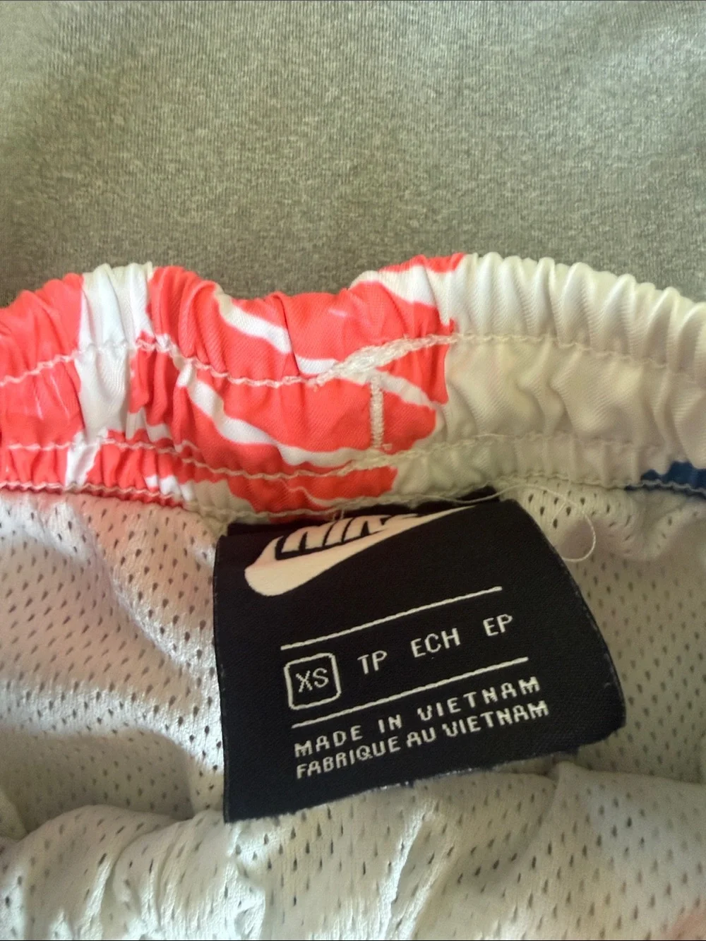 Nike White Swim Shorts with Blue, Green and Pink Logo Print